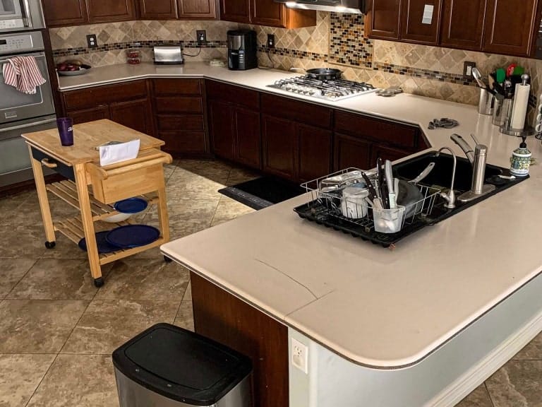 Original countertop in a luxury home before installing a Counter Intelligence Epoxy countertop.